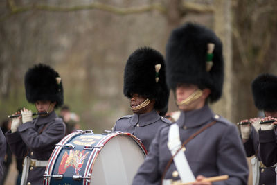 Rear view of people standing outdoors