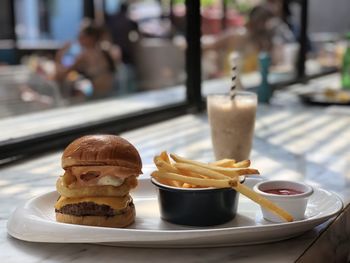 Close-up of burger and french fries