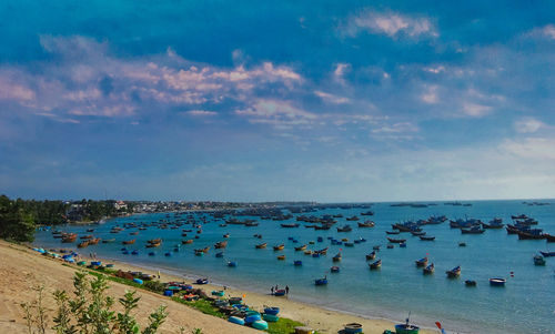 High angle view of people on beach against sky