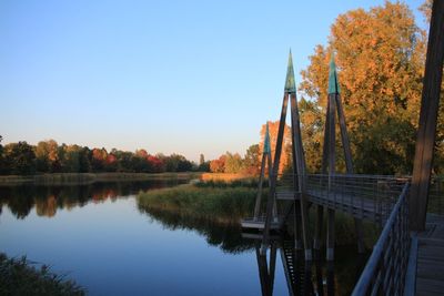 Scenic view of lake against clear sky during autumn