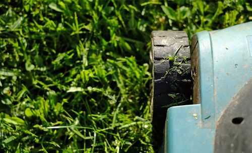 Close-up of old mailbox on field