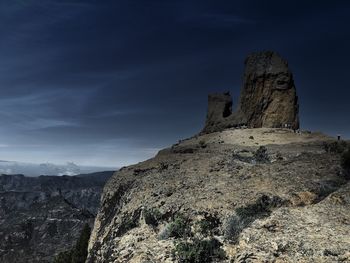 View of rock formations on landscape against sky