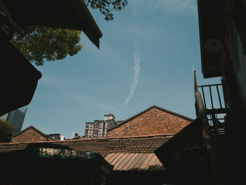 Low angle view of houses against sky