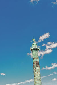 Low angle view of lighthouse against building