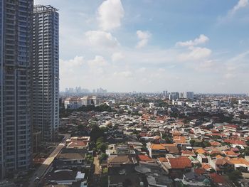 Aerial view of cityscape against sky