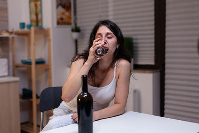 Portrait of beautiful woman sitting at home