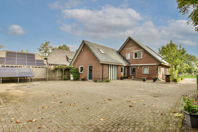 House on field against sky