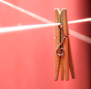 Close-up of chain hanging on wood