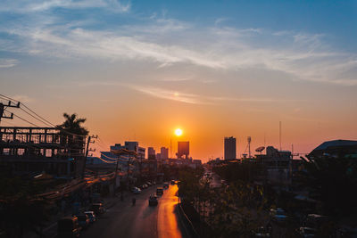 High angle view of buildings against sky during sunset