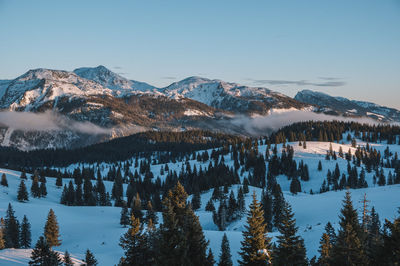 Scenic view of snowcapped mountains against clear sky