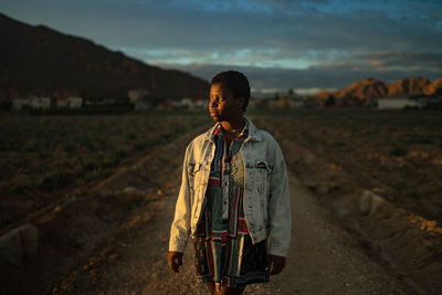 Portrait of teenage girl standing on land