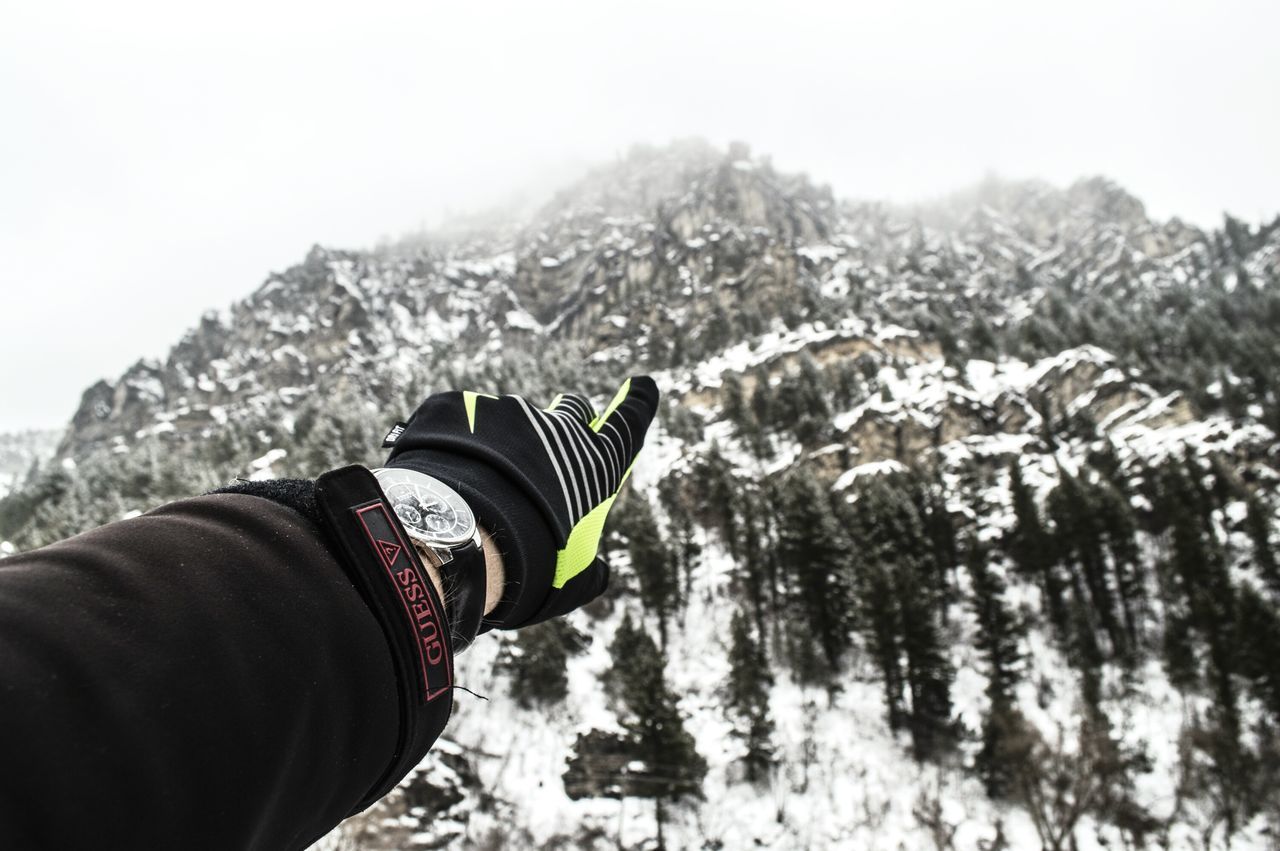 lifestyles, leisure activity, mountain, personal perspective, shoe, unrecognizable person, men, person, low section, winter, adventure, part of, snow, holding, cold temperature, landscape, season