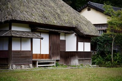 Exterior of abandoned house on field