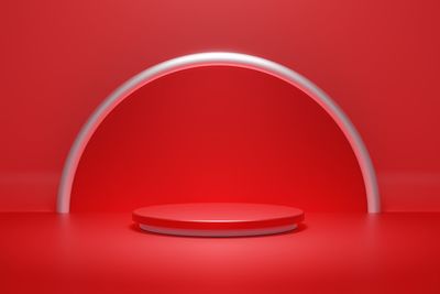 Close-up of electric lamp against red background