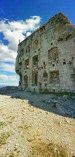Built structure against cloudy sky