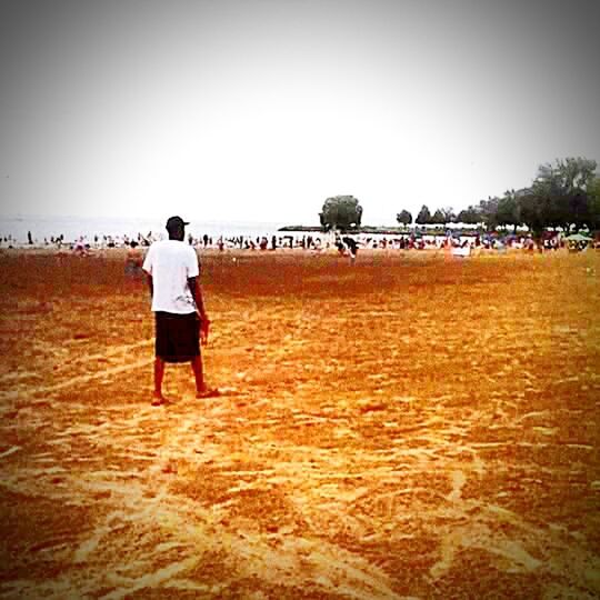 sand, beach, clear sky, lifestyles, leisure activity, shore, rear view, sea, copy space, full length, walking, vacations, person, men, tranquil scene, tranquility, nature, water