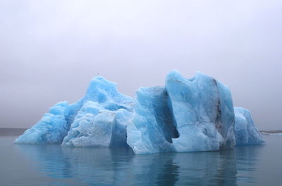 Scenic view of frozen sea against sky