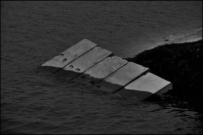 High angle view of text on sea shore