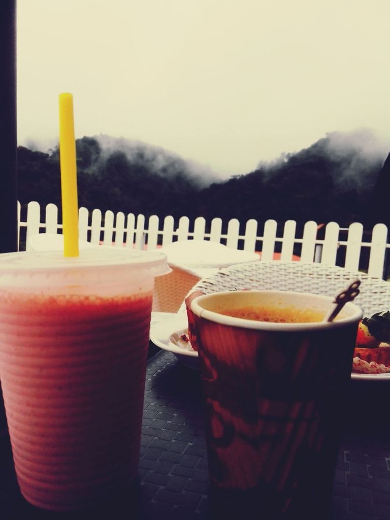 table, drink, sky, still life, chair, no people, empty, food and drink, wood - material, close-up, absence, in a row, focus on foreground, red, day, outdoors, refreshment, auto post production filter, side by side, container