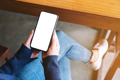 High angle view of person using mobile phone