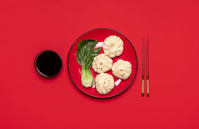 High angle view of food served on red table