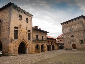 View of historic building against cloudy sky