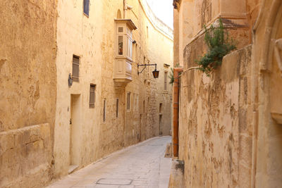 Narrow alley amidst buildings in malta