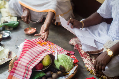 High angle view of people working on table