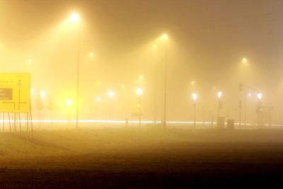 Illuminated lights against sky at night