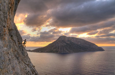 Scenic view of sea against cloudy sky