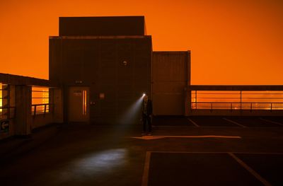 View of illuminated building at sunset