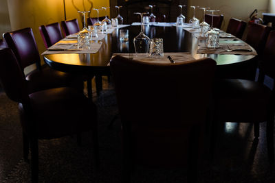 Empty chairs and tables in restaurant
