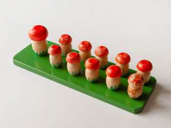 High angle view of tomatoes on table against white background