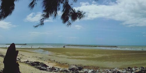 Scenic view of beach against sky