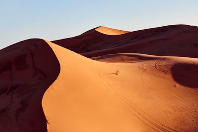 Scenic view of desert against clear sky