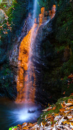 Water flowing through rocks in forest