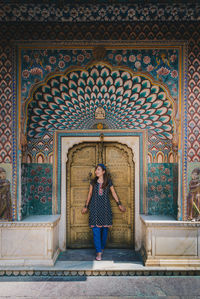 Woman standing outside temple