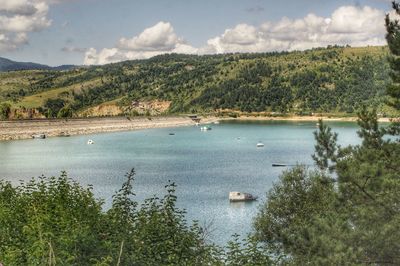 Scenic view of bay against sky