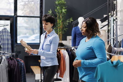 Side view of business colleagues working at office