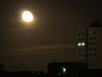 Illuminated building against sky at night