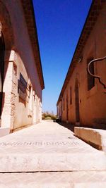 Narrow alley along buildings