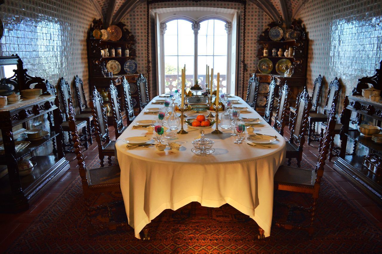 CHAIRS AND TABLES IN GLASS WINDOW