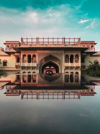 View of bridge over river against cloudy sky