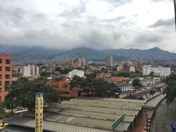 High angle view of buildings in city against sky