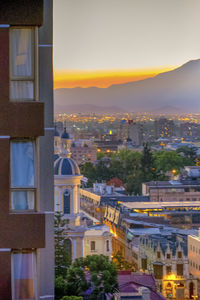 Cityscape against sky during sunset