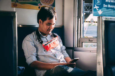 Young man using mobile phone