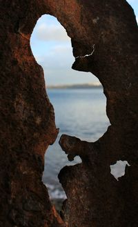 Close-up of rock formation against sky