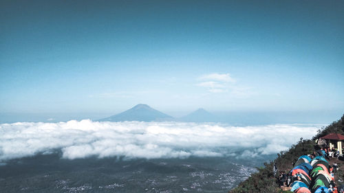 Scenic view of mountains against blue sky