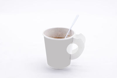 Close-up of coffee cup against white background