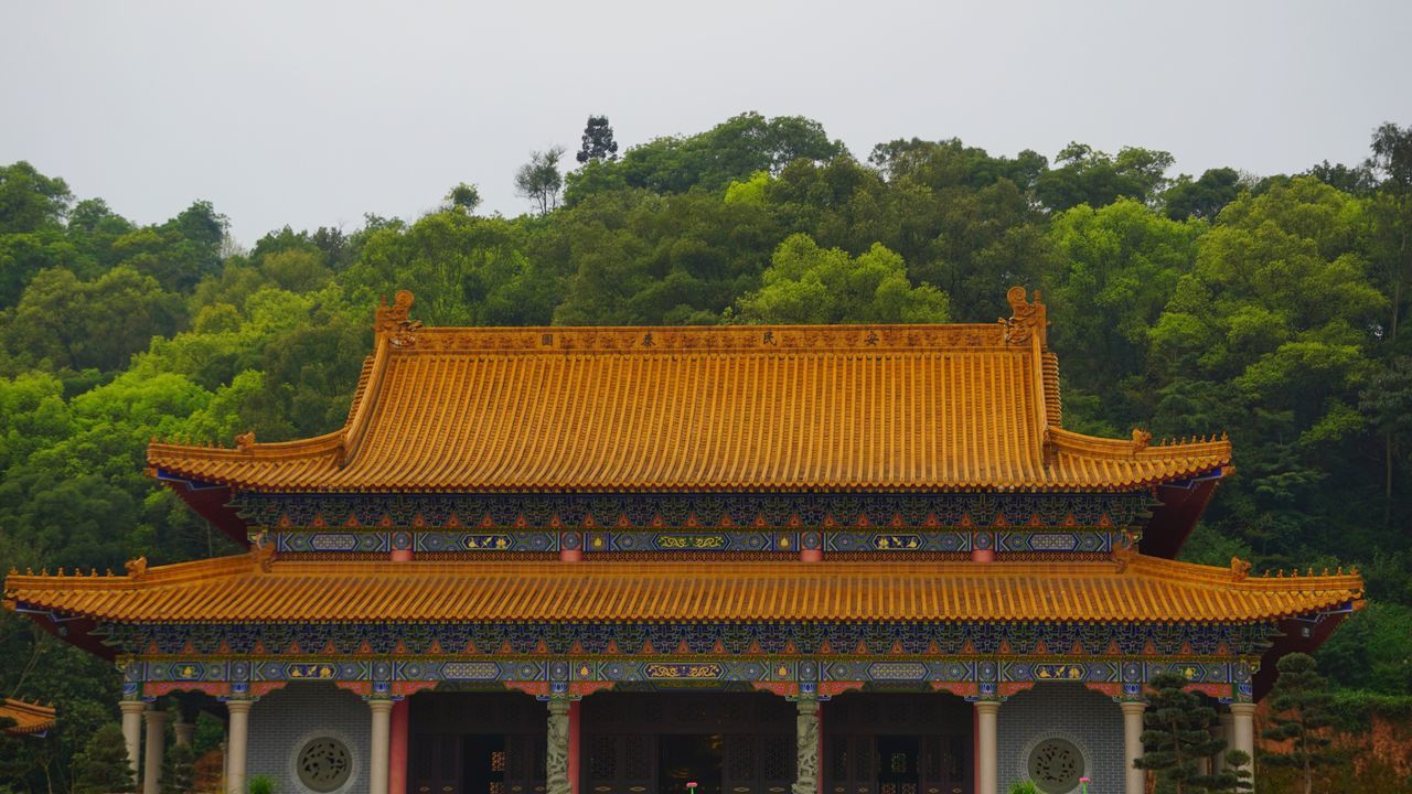 temple - building, architecture, place of worship, religion, built structure, building exterior, tree, spirituality, temple, tradition, cultures, pagoda, roof, culture, low angle view, famous place, travel destinations, traditional